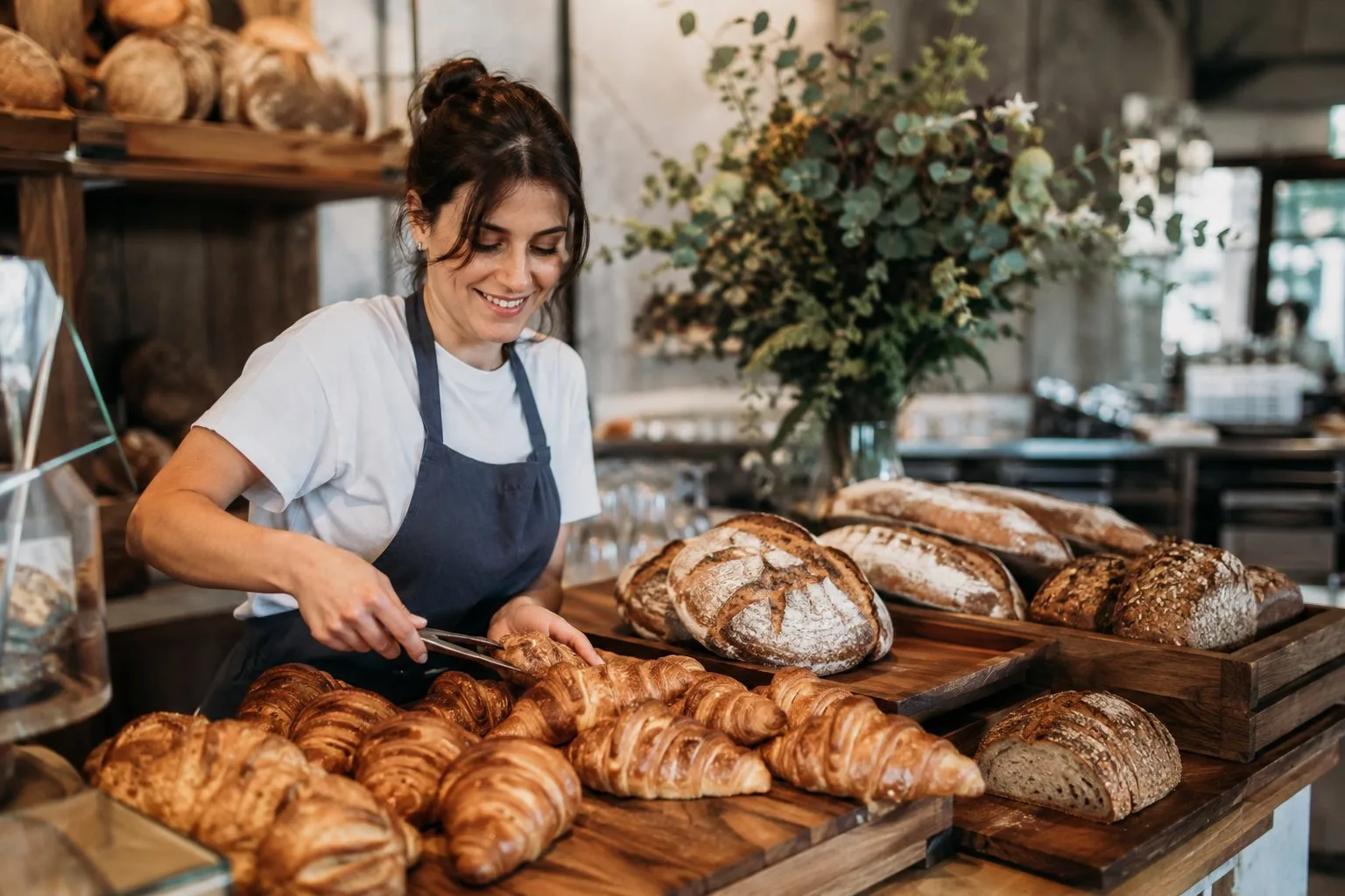 Artisan bakery counter with croissants and sourdough loaves