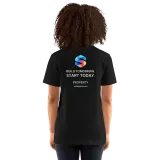 Build Tomorrow Tee in Black — female model, back view